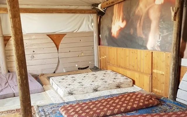 A room at the Khan: wood and mattresses